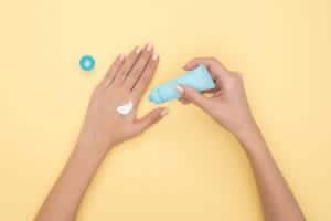 person pouring plastic tube bottle 1029896